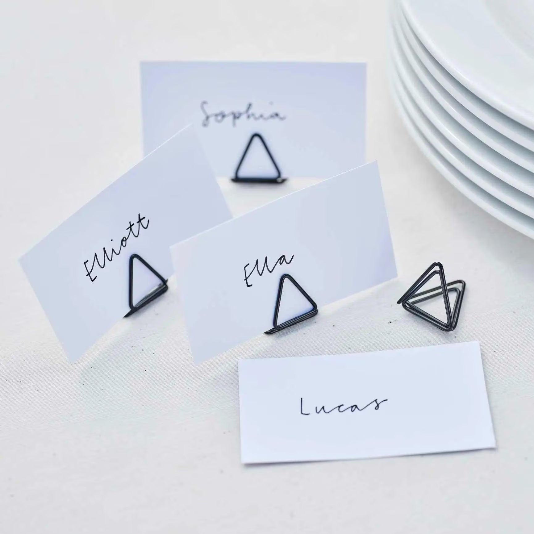 Black wire buffet label holders with name cards for events.